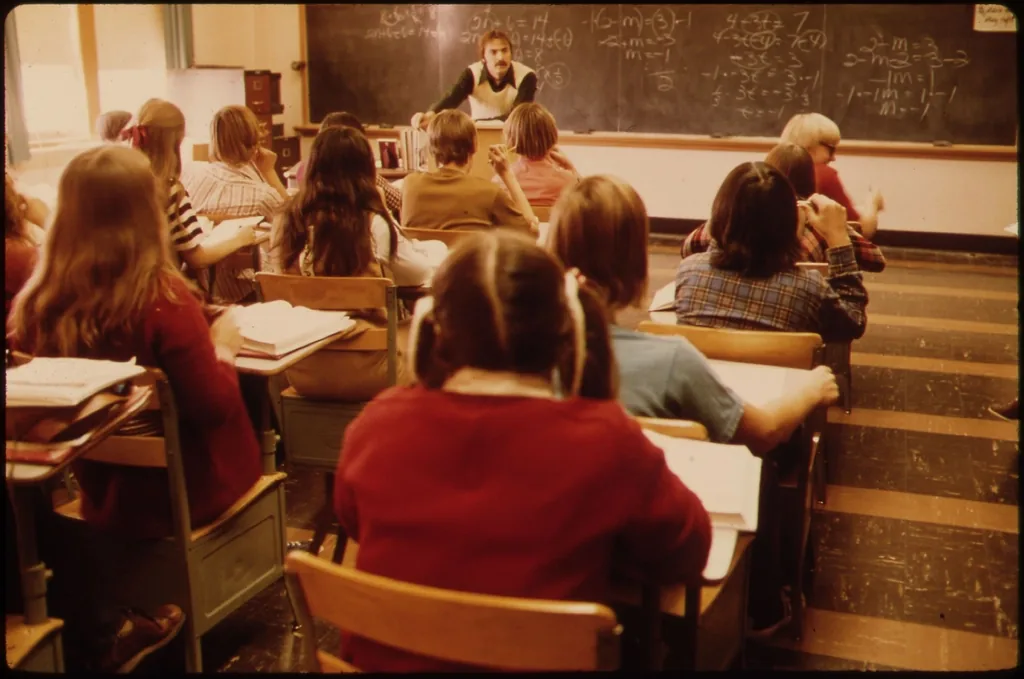 Students working at desks during a classroom session